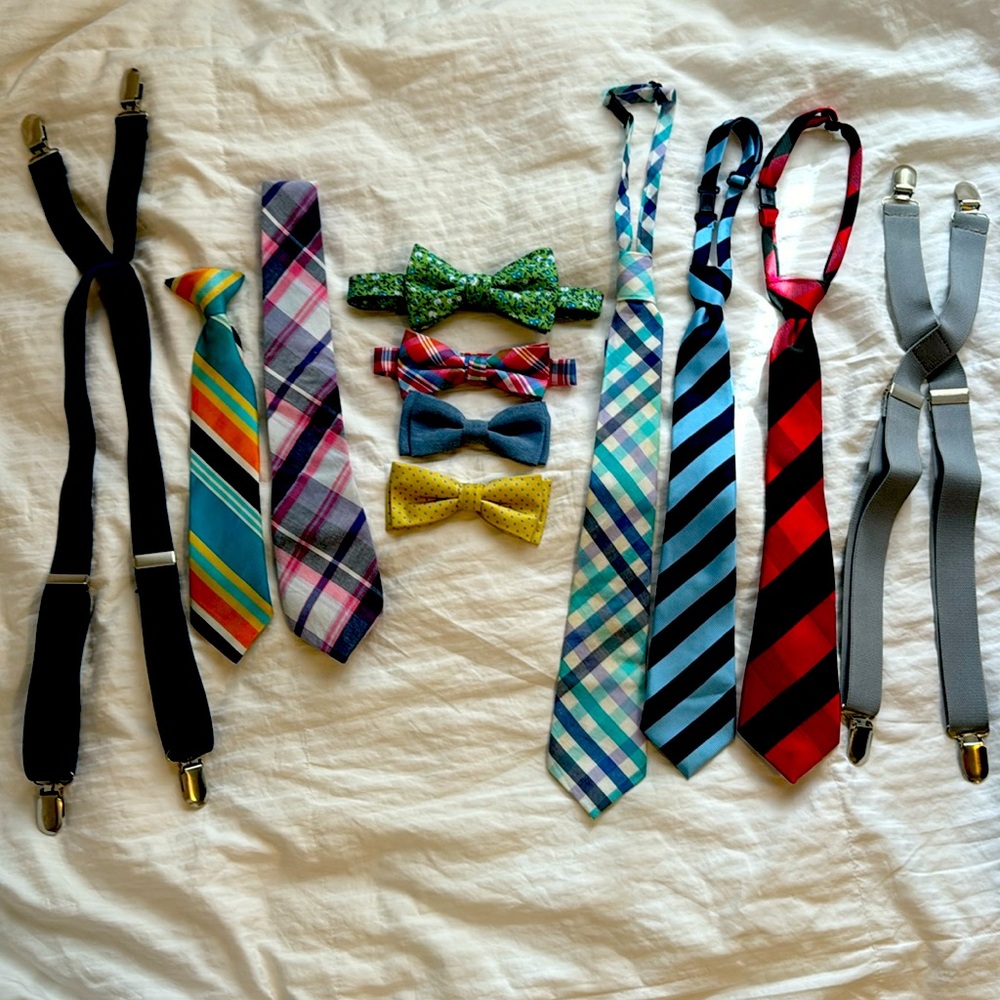 Lot of bow ties, ties, suspenders and belts for little boy